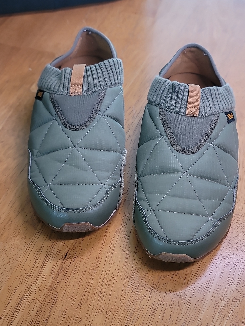 Ember Moc slip-on shoes featuring a quilted upper and ribbed knit collar